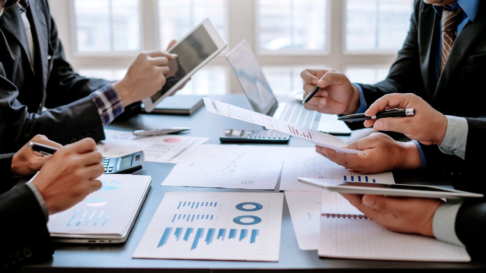 Business people brainstorm, discuss, plan and analyze business i
